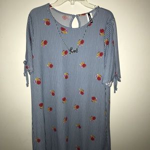 Blue and White Dress with a Necklace